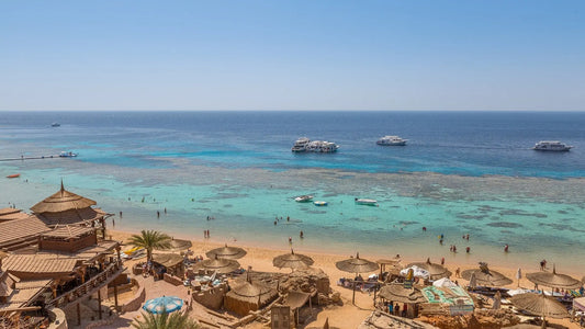 a great looking beach with people and sand on a sunny day as travel target for esim