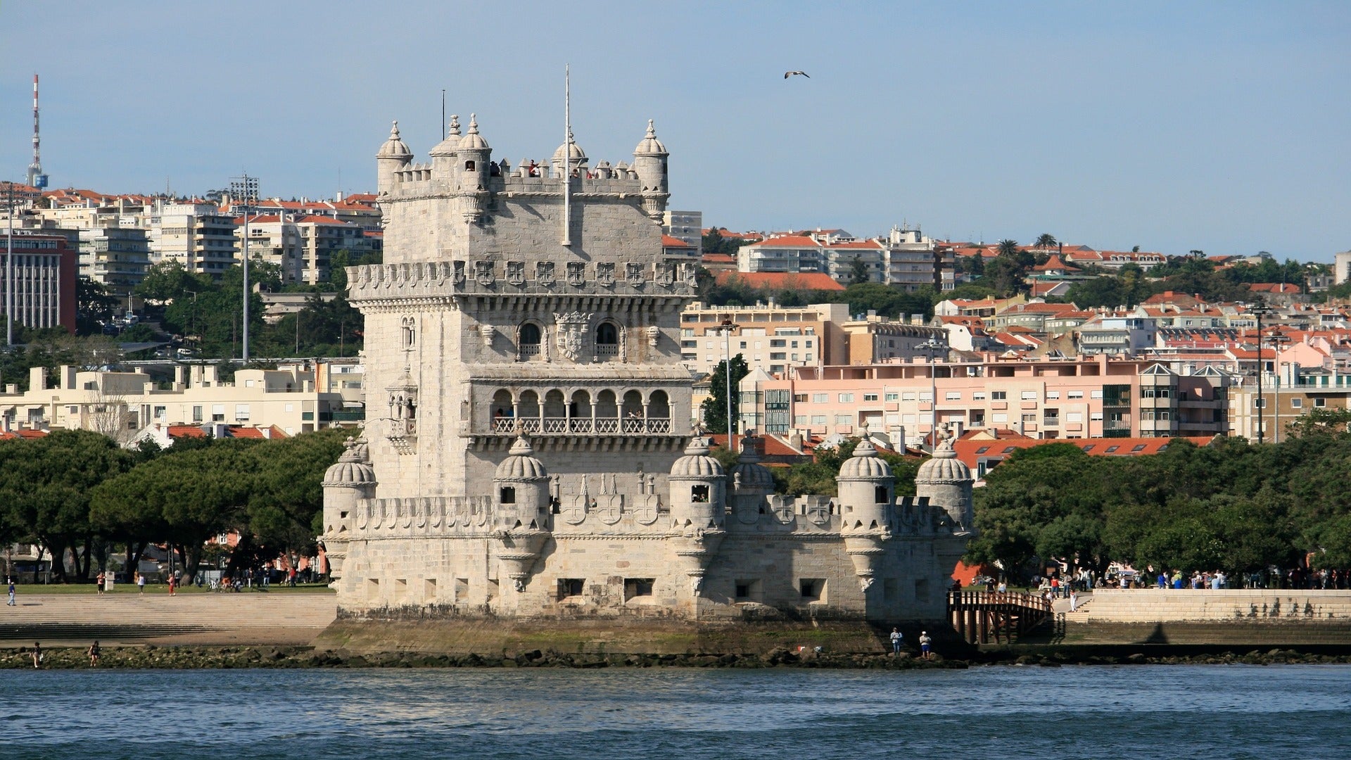 Water and portugese buildings with as small castle as travel target for esim